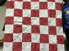 Peg Barnes-a red and white alternating block quilt, as a Community Service donation